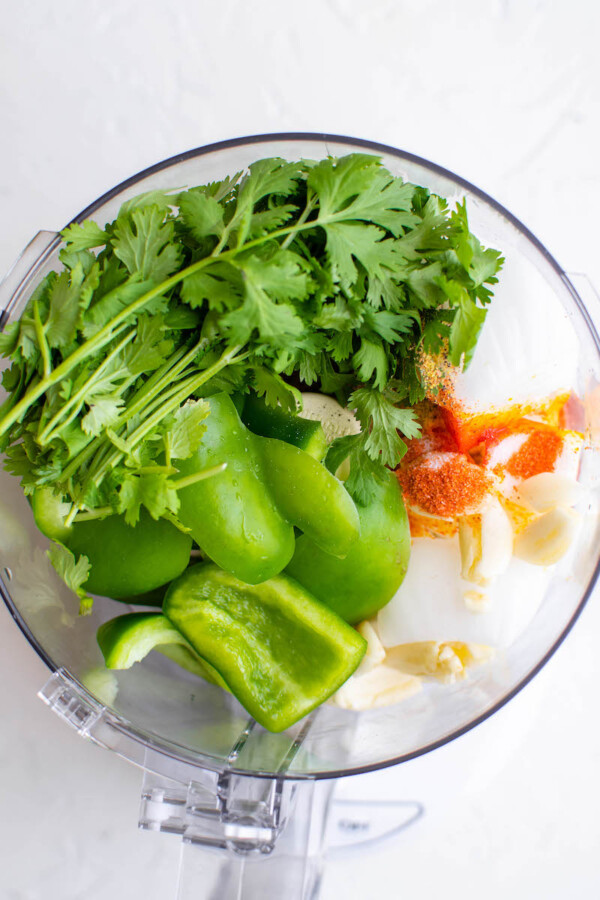 The vegetables are in a blender, ready to be blended together.