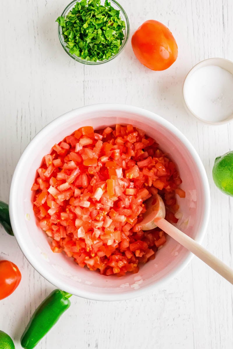 Chopped roma tomatoes in a bowl.
