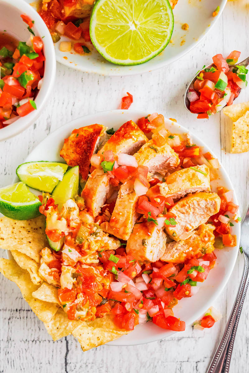 Cut up chicken with pico de gallo.