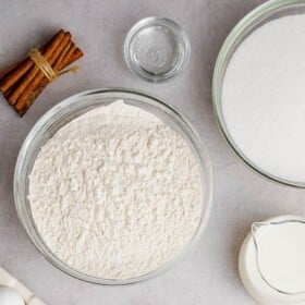 Top view of bowls of wet and dry ingredients for Rumchata Pound Cake