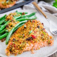 Plate of sun dried tomato parmesan crusted salmon.