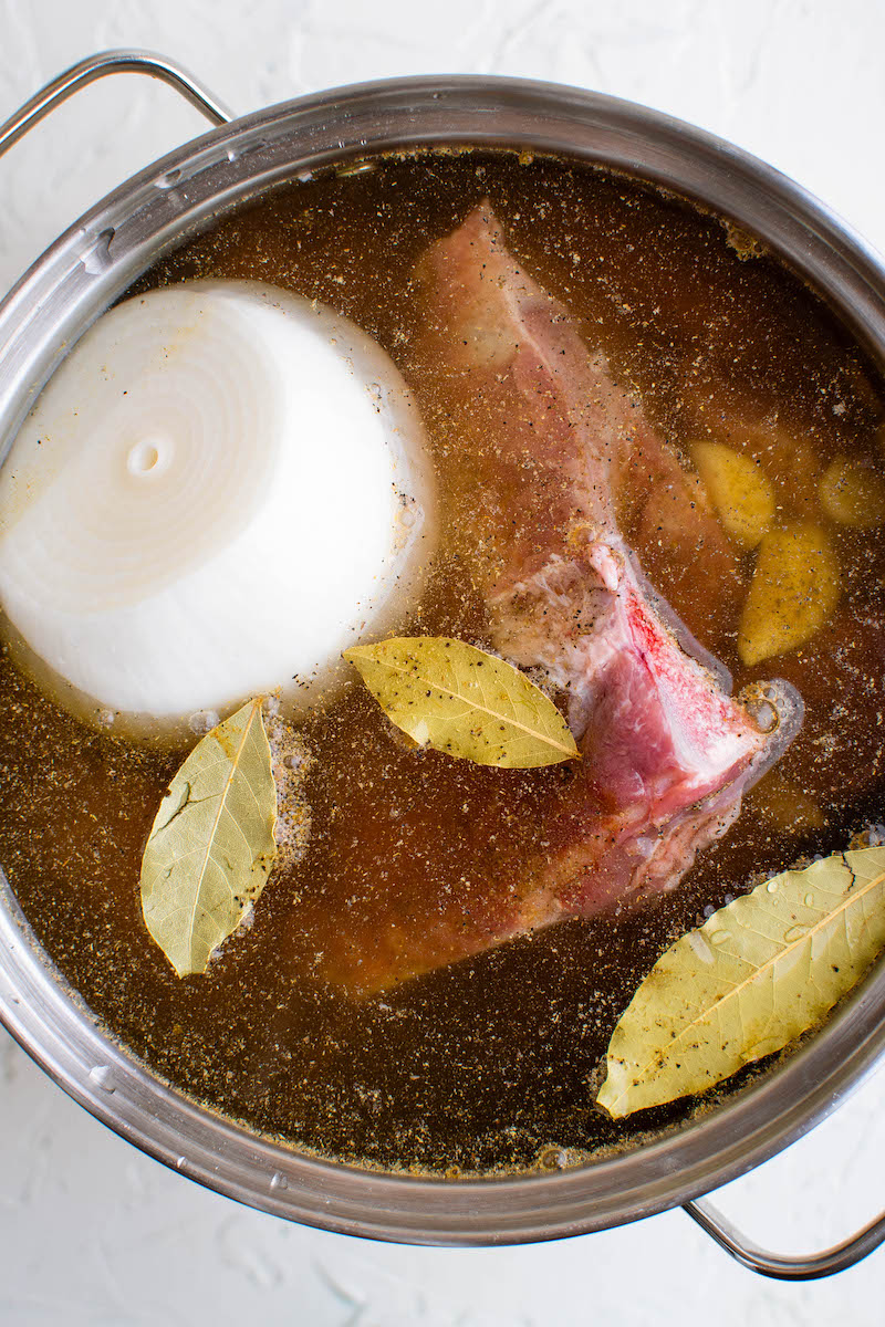 Pork broth ingredients in a pot.