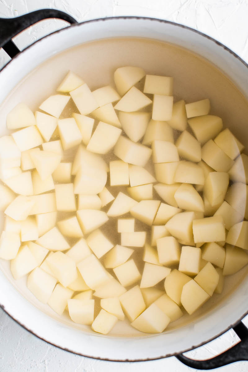 Potato cubes in a pot.