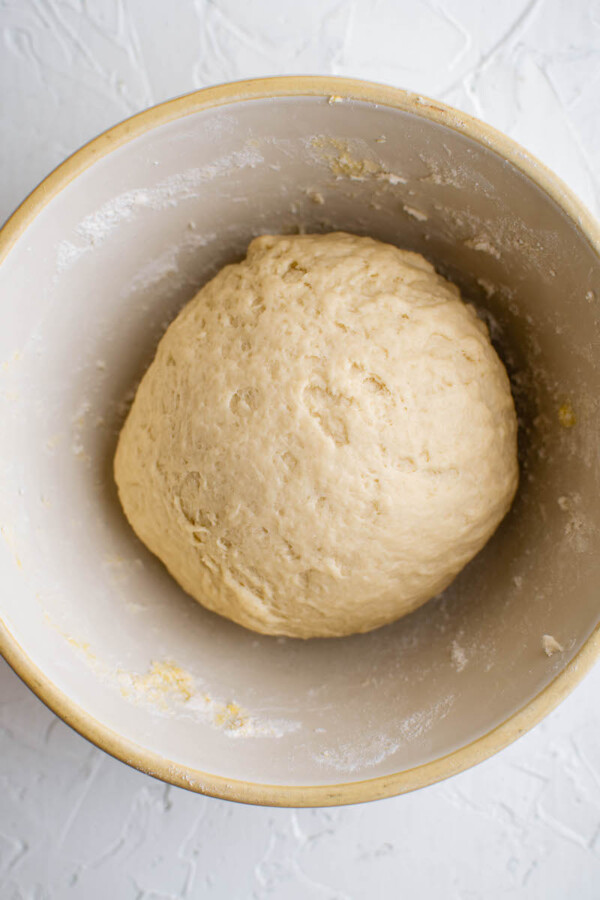Ball of empanada dough in a bowl.