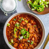 Bowl of keto chili with garnishes.