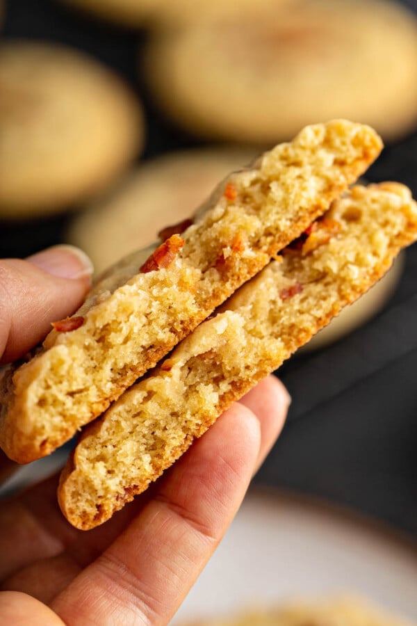 Two cookies are cut in half, showing that they're cooked all the way through.