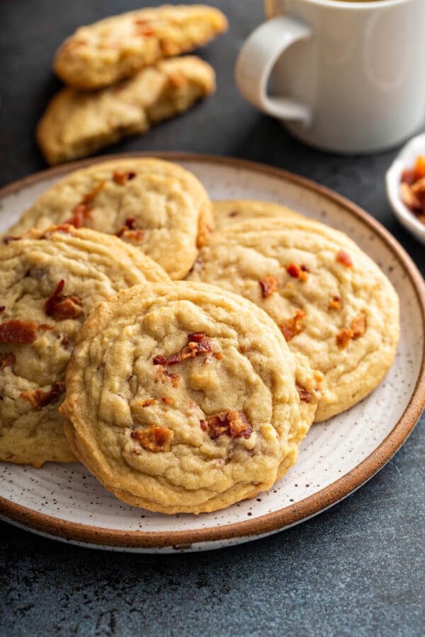 A white plate holds several pancake cookies.