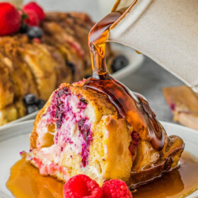 Berry stuffed french toast with maple syrup.