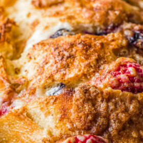 Up close image of Stuffed French toast in a baking pan.