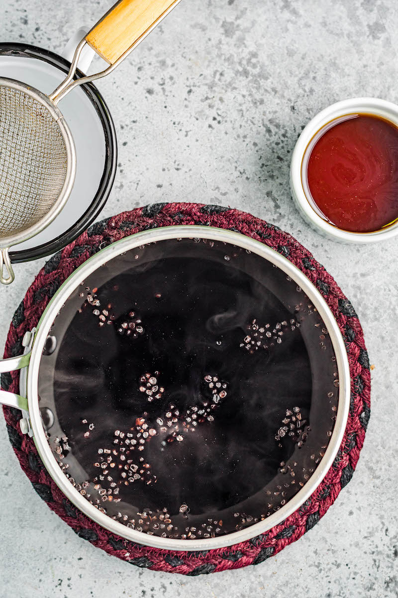 Elderberry syrup in a pan.