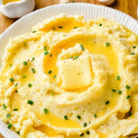 Garlic mashed potatoes with a pad of butter.
