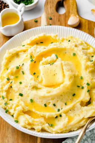 Garlic mashed potatoes with a pad of butter.