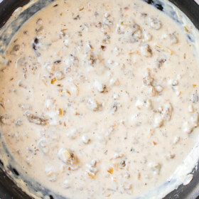 Overhead image of sausage gravy in a non stick skillet.