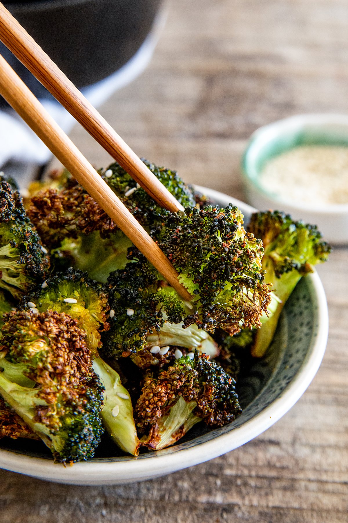 Bowl of crispy air fryer Asian roasted broccoli.