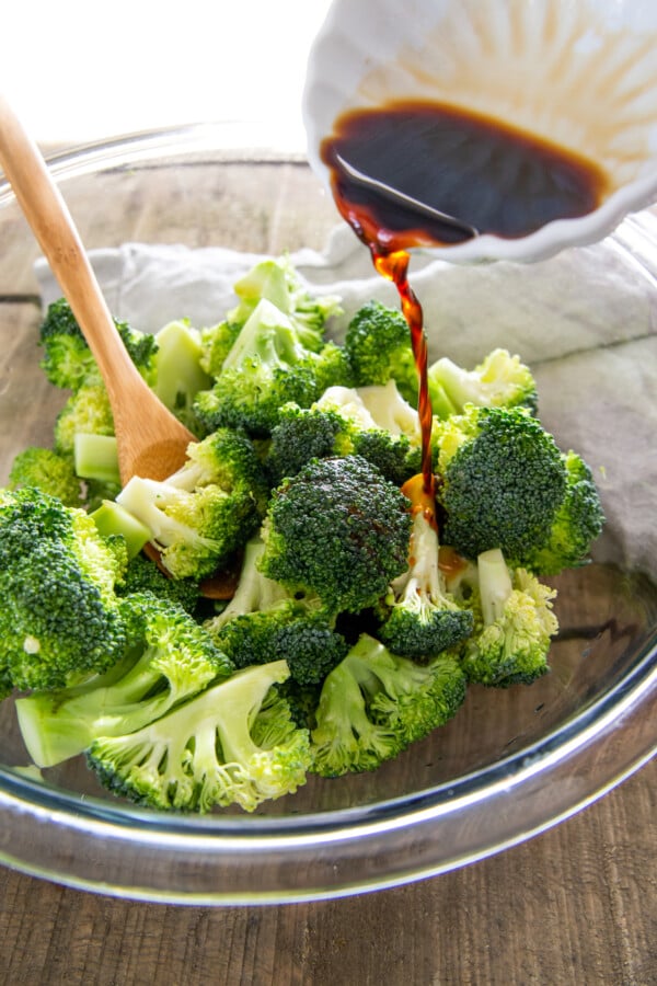 Seasoning mixture poured over broccoli florets.