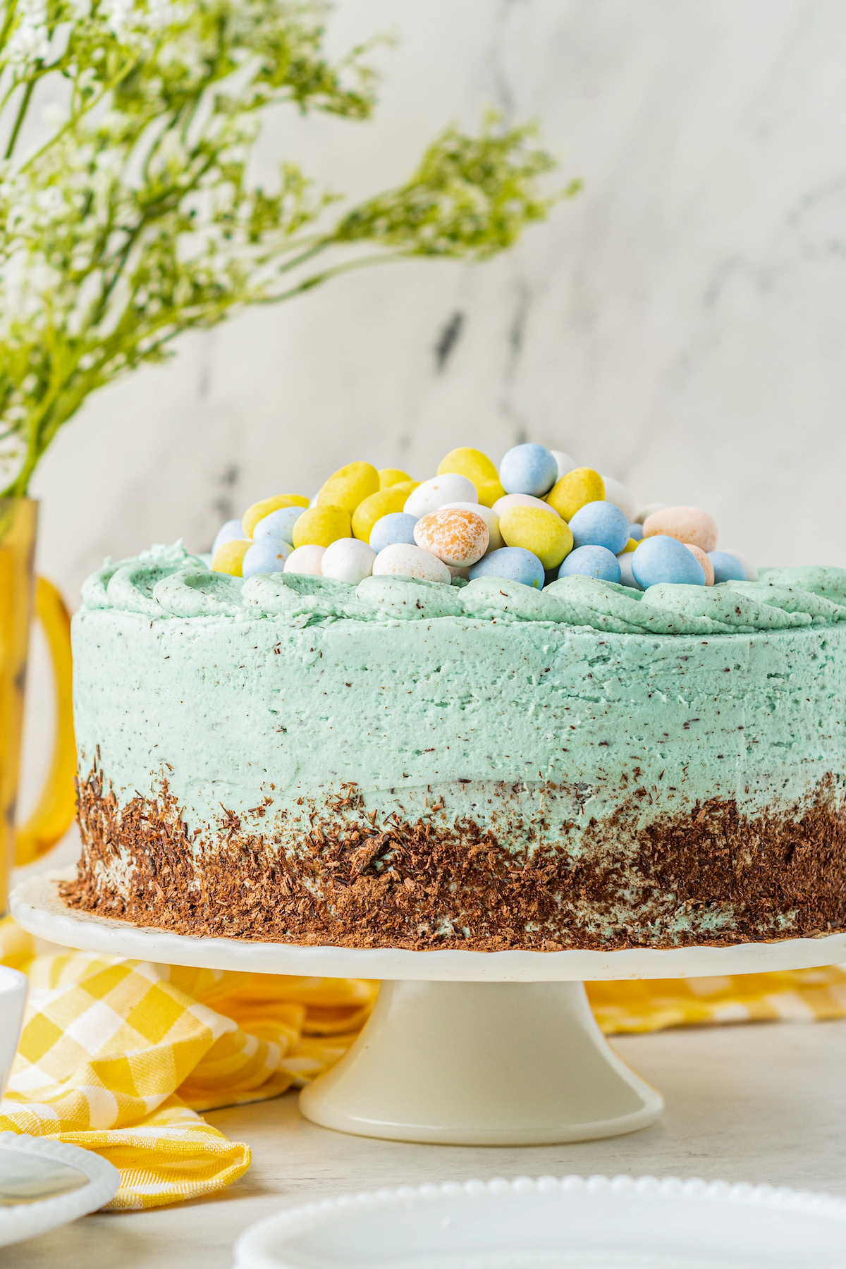 Easter egg cake on a cake platter.