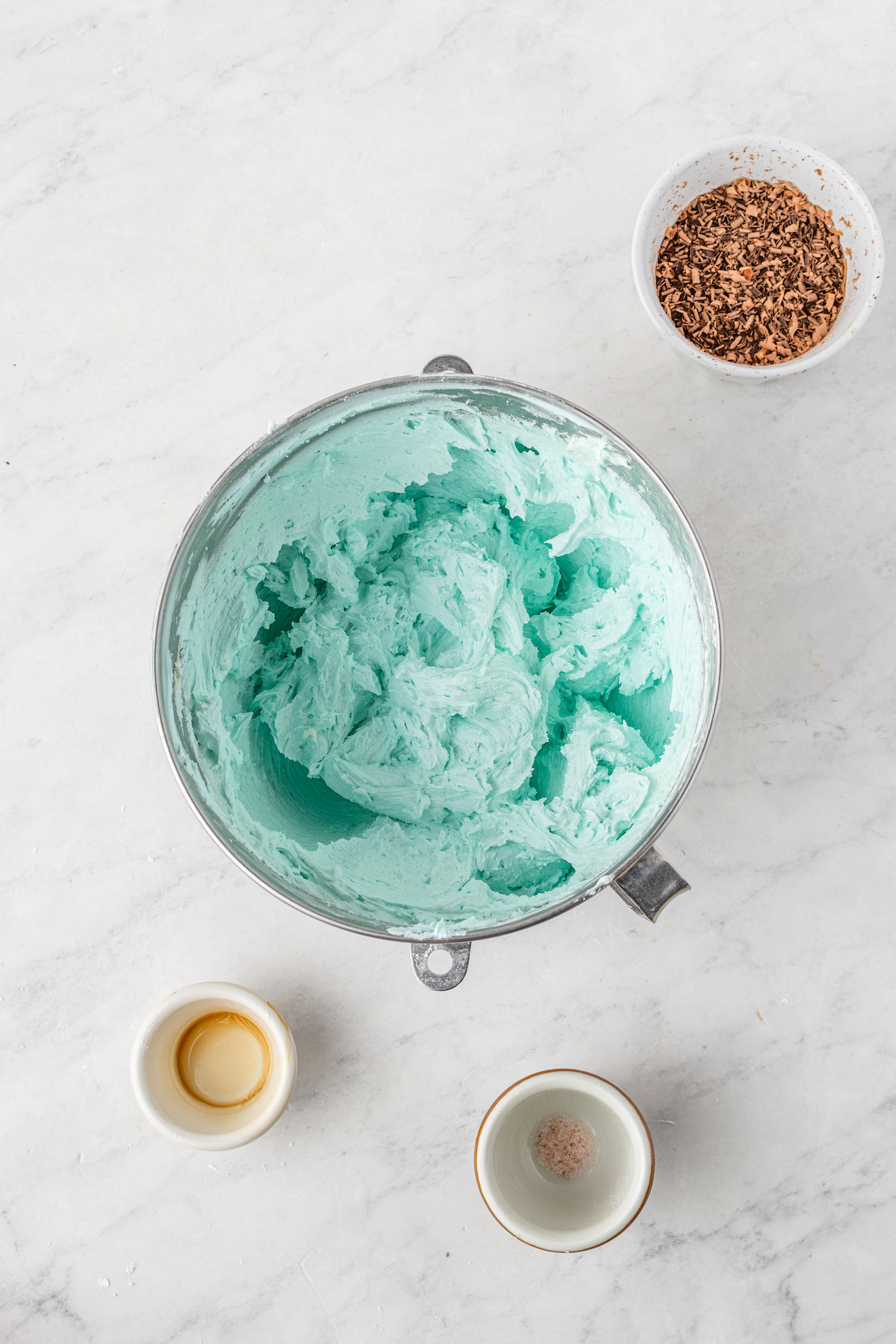 Blue buttercream frosting in a bowl.