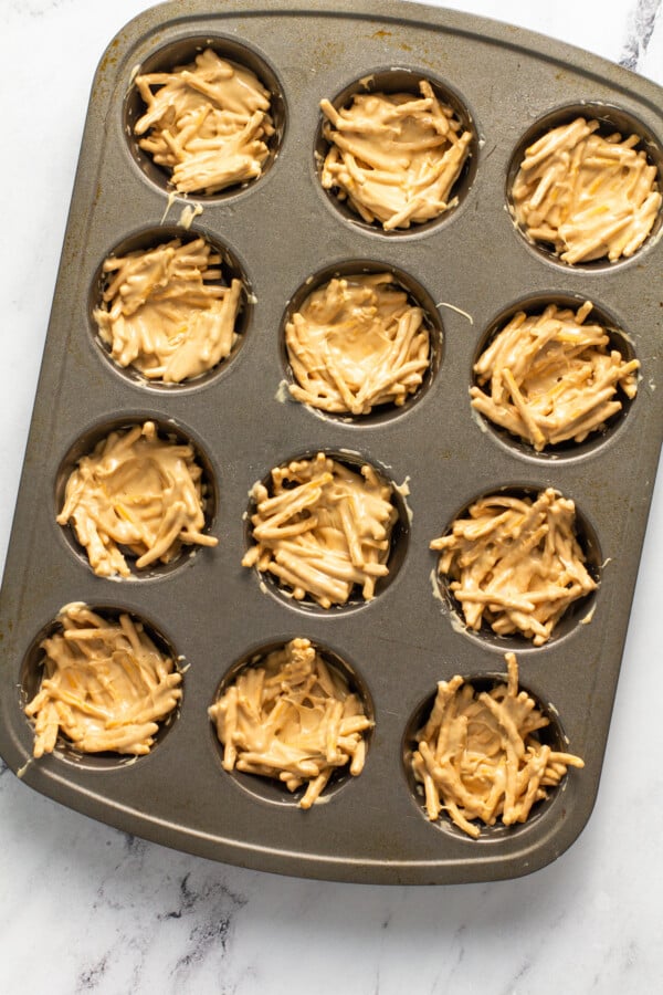 The haystacks are pressed into the prepared muffin tins.