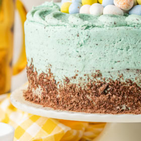 Easter egg cake on a cake platter.