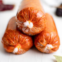 Homemade chorizo in plastic wrap.