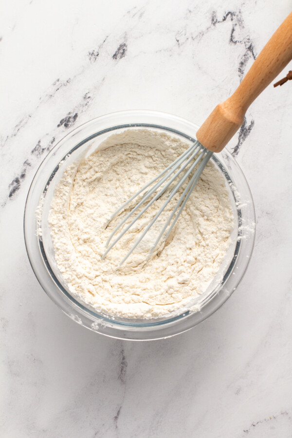 Batter is being mixed with a whisk.