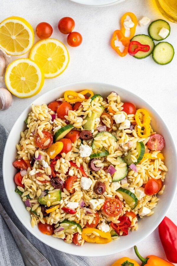 Orzo and vegetables on a plate.