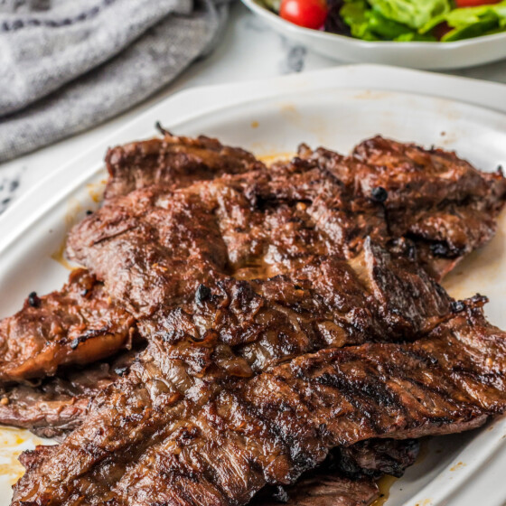 A plate of tender, grilled flank steaks.