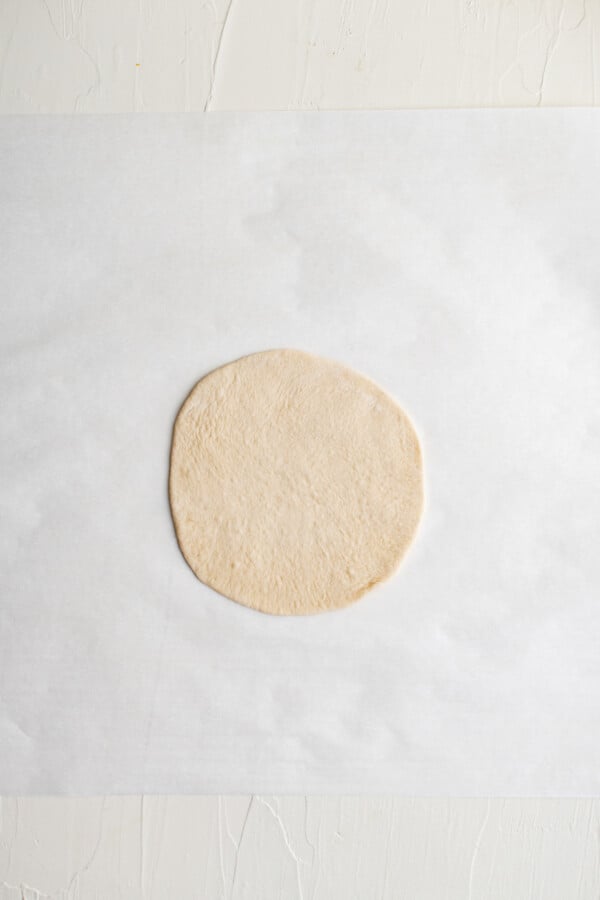 Rolled out dough for pita bread.