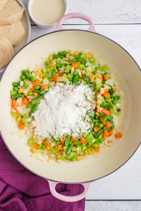 Vegetables and flour in a skillet.