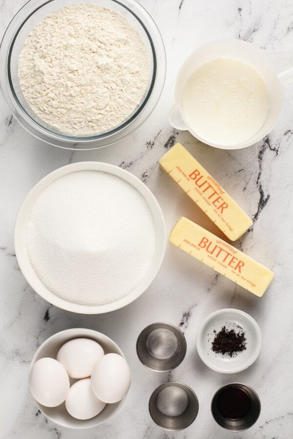 Ingredients in bowls with butter sticks.