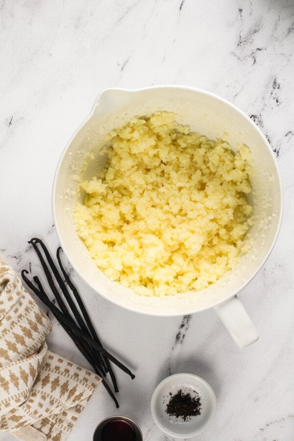 Overhead image of a bowl with butter and sugar beaten together. 