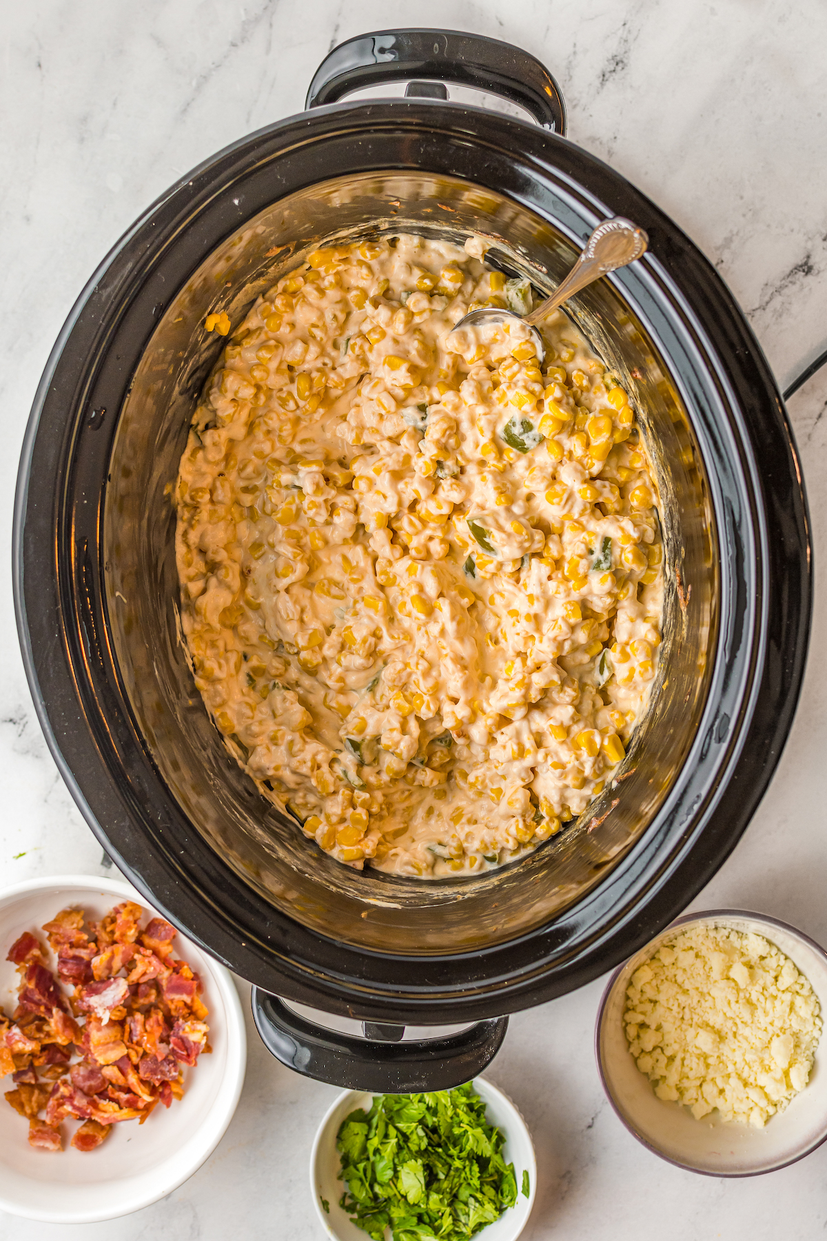 Cooked corn dip in a crockpot.
