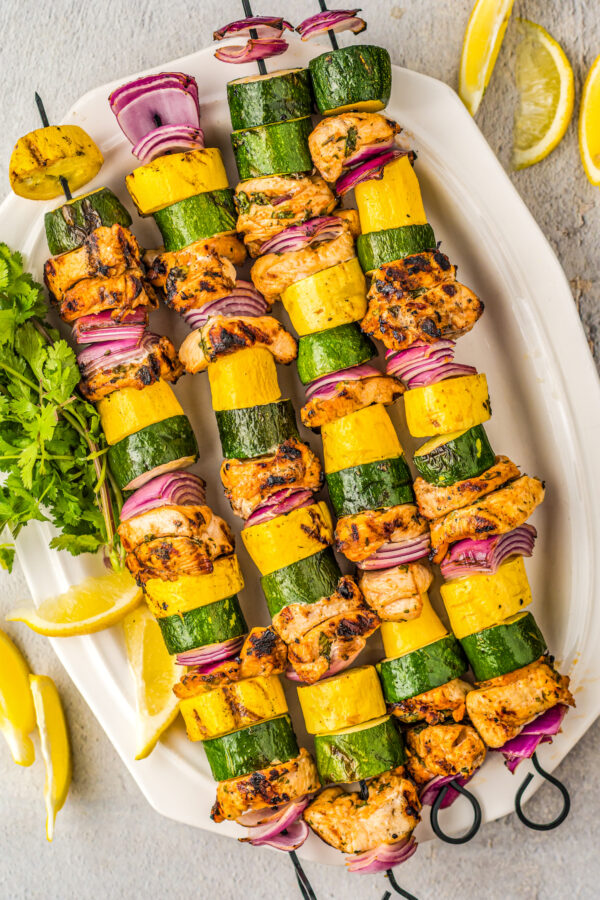 Plate of chicken skewers.