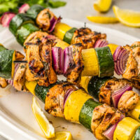 Plate of marinated chicken kabobs.