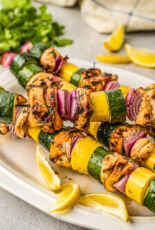 Plate of marinated chicken kabobs.
