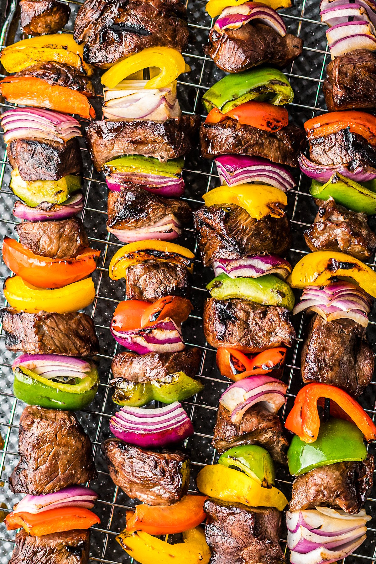 Grilled steak and veggies on skewers.