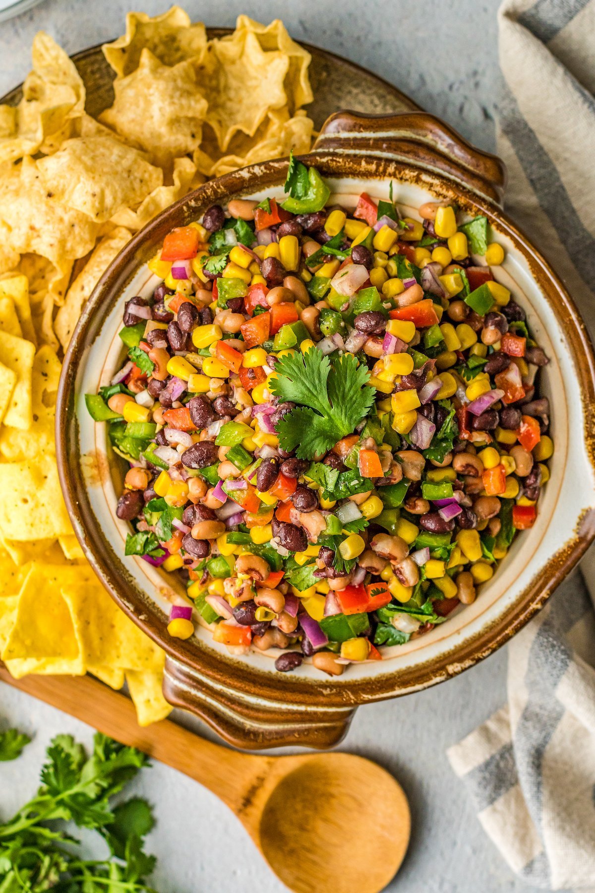 Bowl of Texas caviar with cilantro leaves.