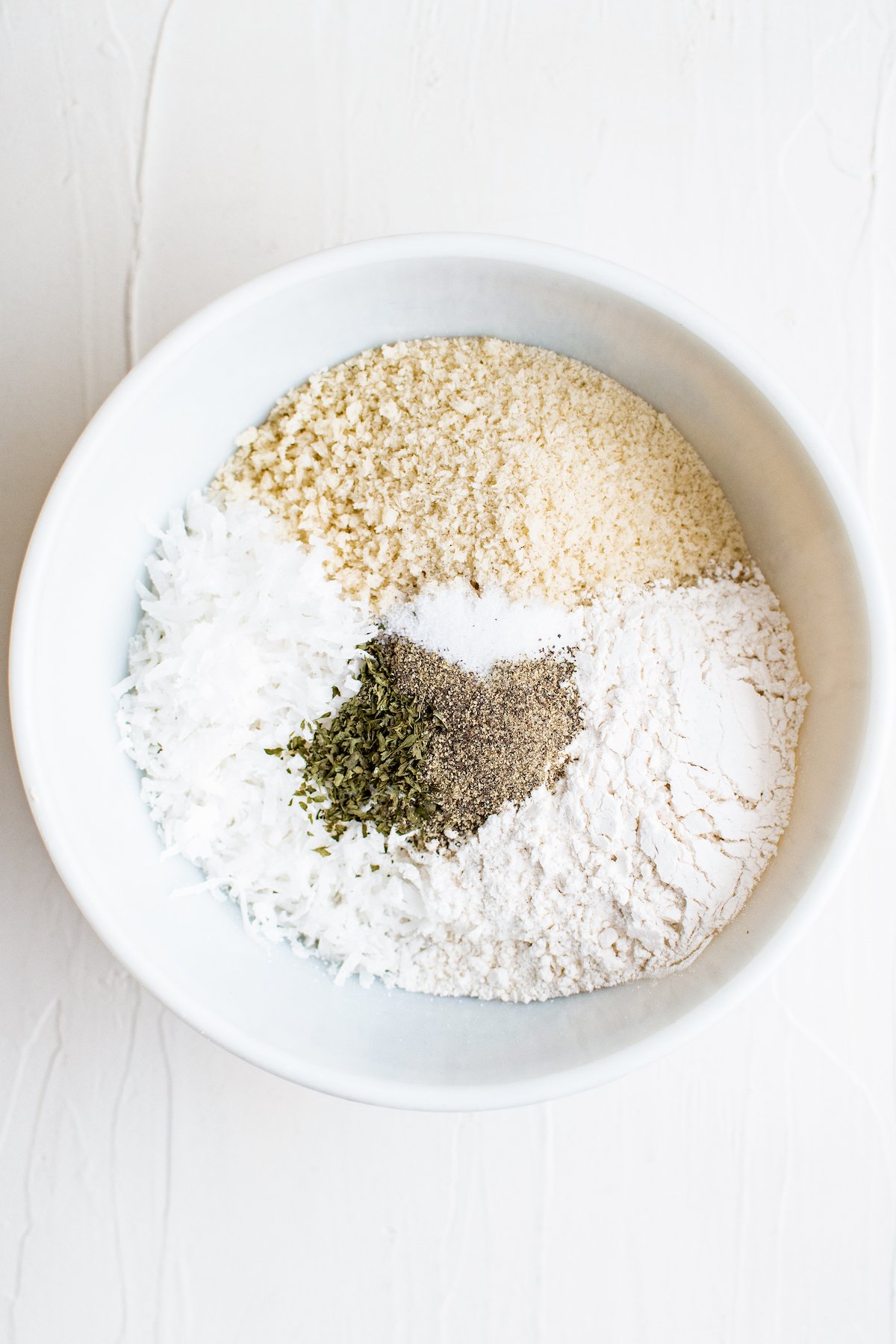 Dry breading ingredients for coconut shrimp.