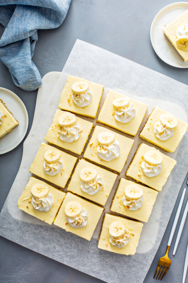 A block of banana pudding has been sliced into twelve even bars.