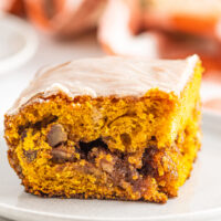 Slice of pumpkin honeybun cake with glaze and pecan filling.