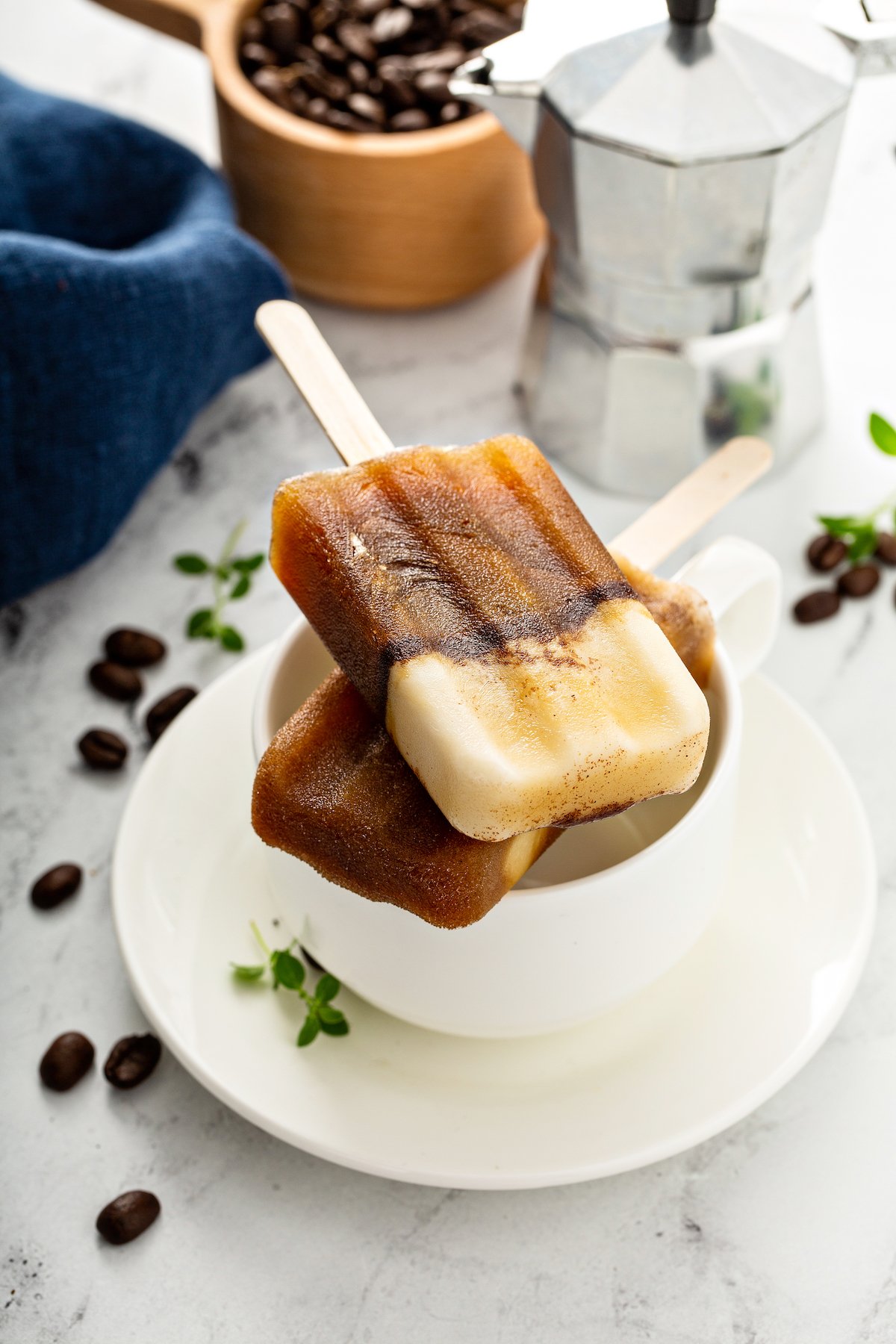 espresso popsicles over a coffee cup