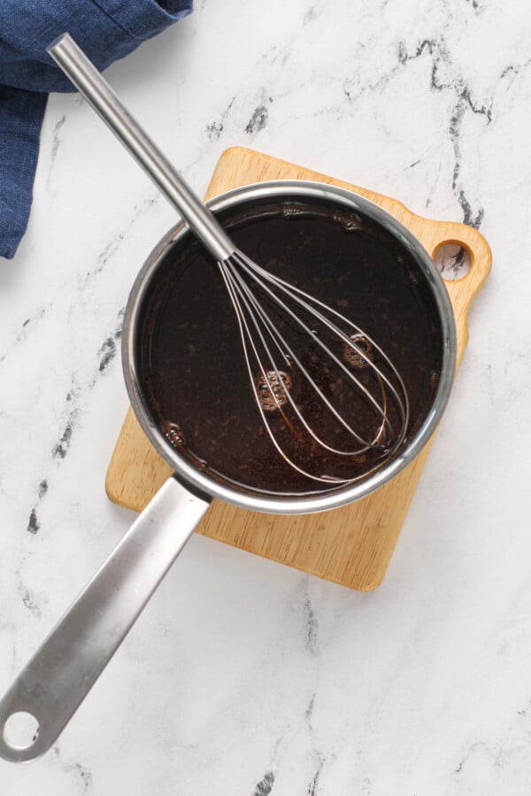 pot with whisk holding brown sugar mixture