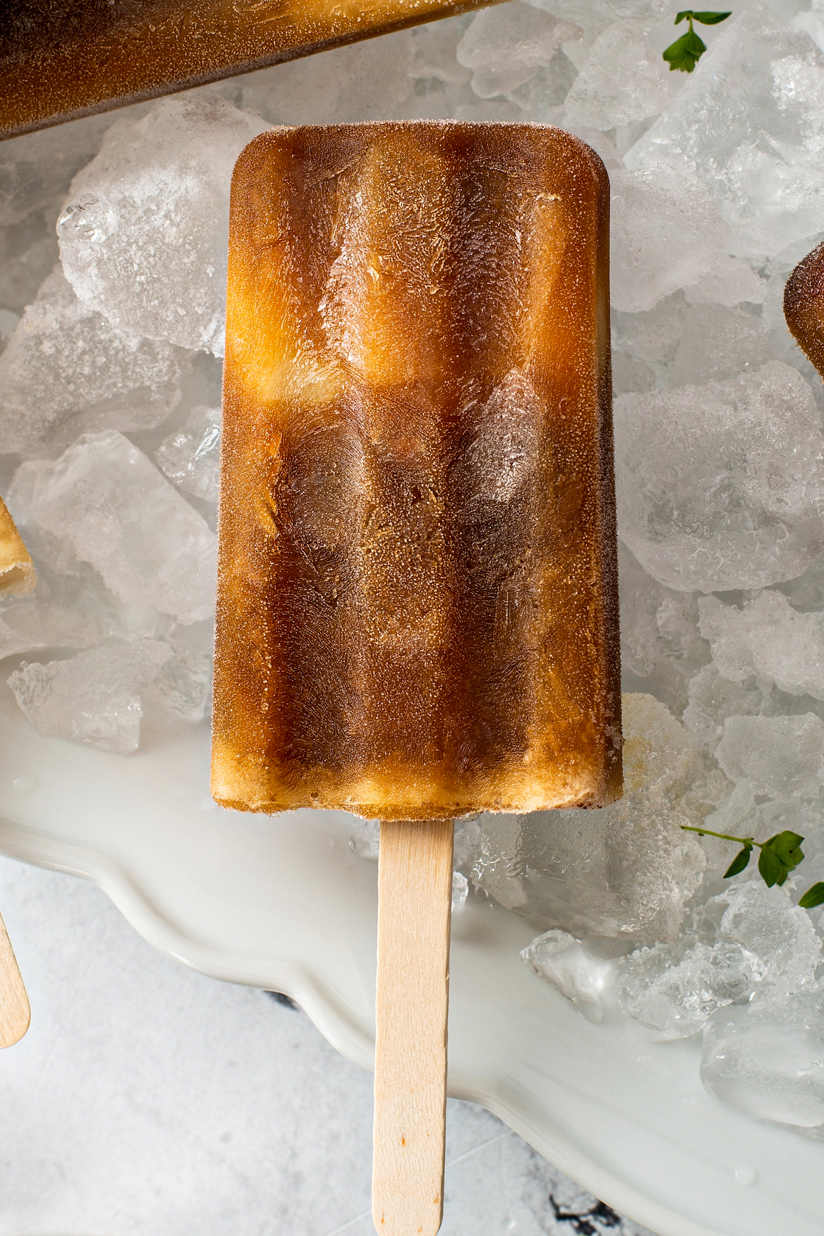 single popsicle on a plate of ice