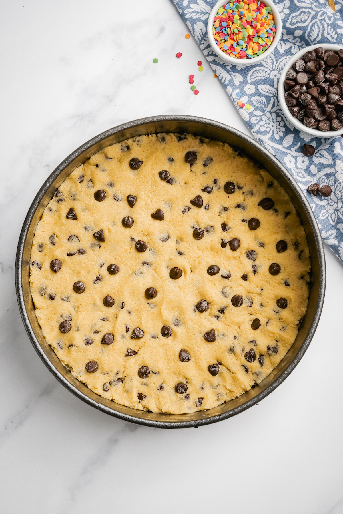 Cookie dough pressed in a springform pan.