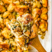 Homemade stuffing on a wooden spatula.