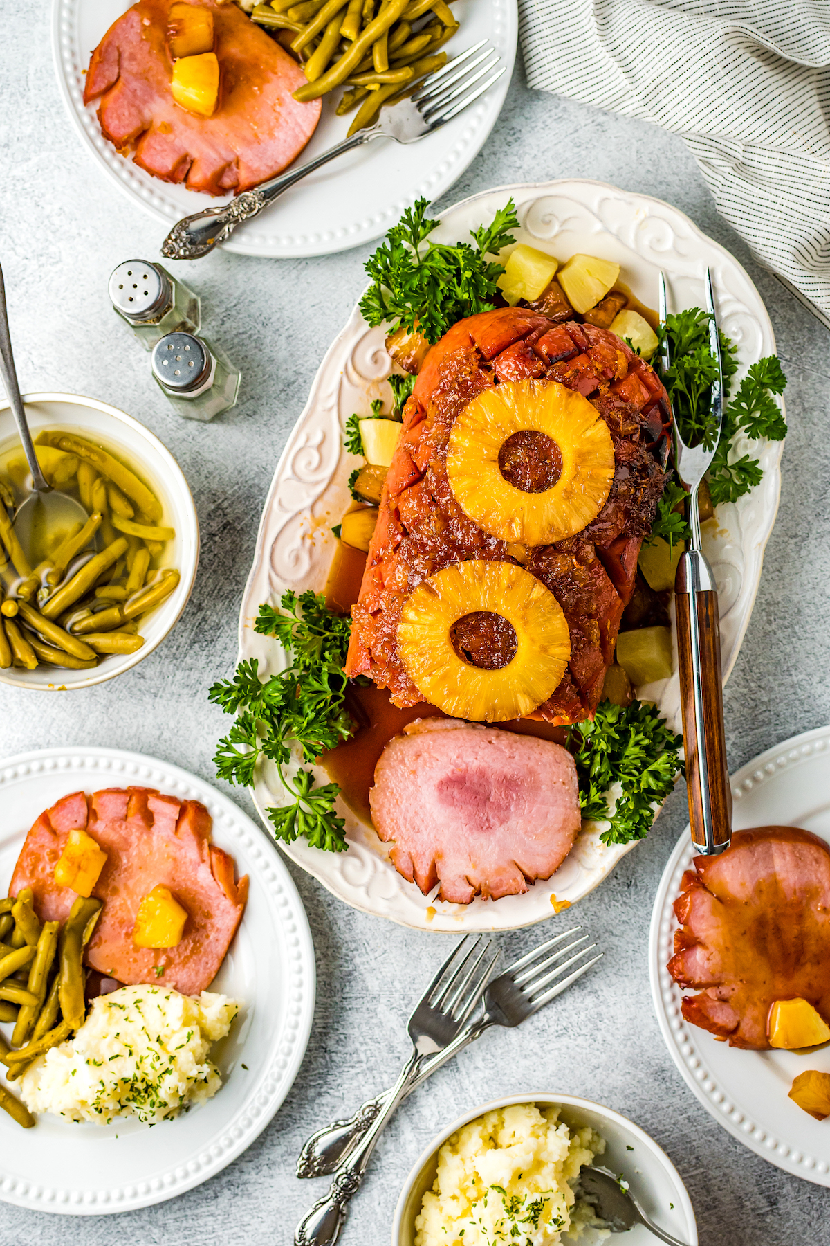 A holiday dinner featuring air-fried ham with pineapple rings.