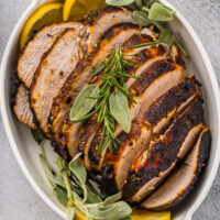 An overhead shot of sliced air-fried turkey in a serving dish.