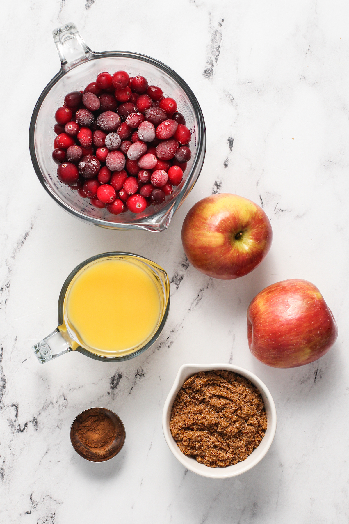 Clockwise from top: fresh cranberries, Fuji apples, brown sugar, cinnamon, orange juice.