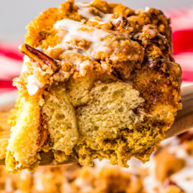 A slice of pumpkin French toast casserole on a spatula.