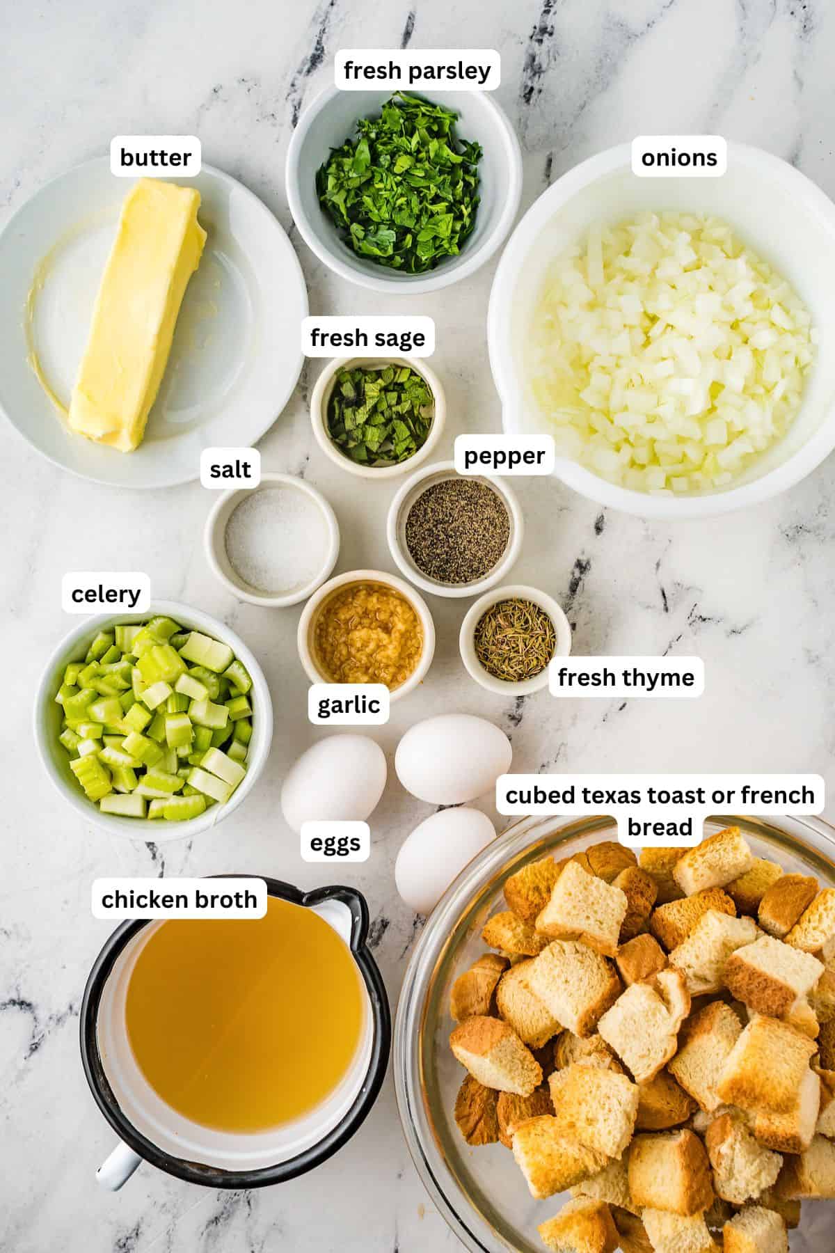 Ingredients for homemade stuffing recipe in order from top to bottom: butter, fresh parsley, onion, salt, pepper, fresh sage, celery, garlic, fresh thyme, chicken broth, eggs, cubed Texas toast or French bread.